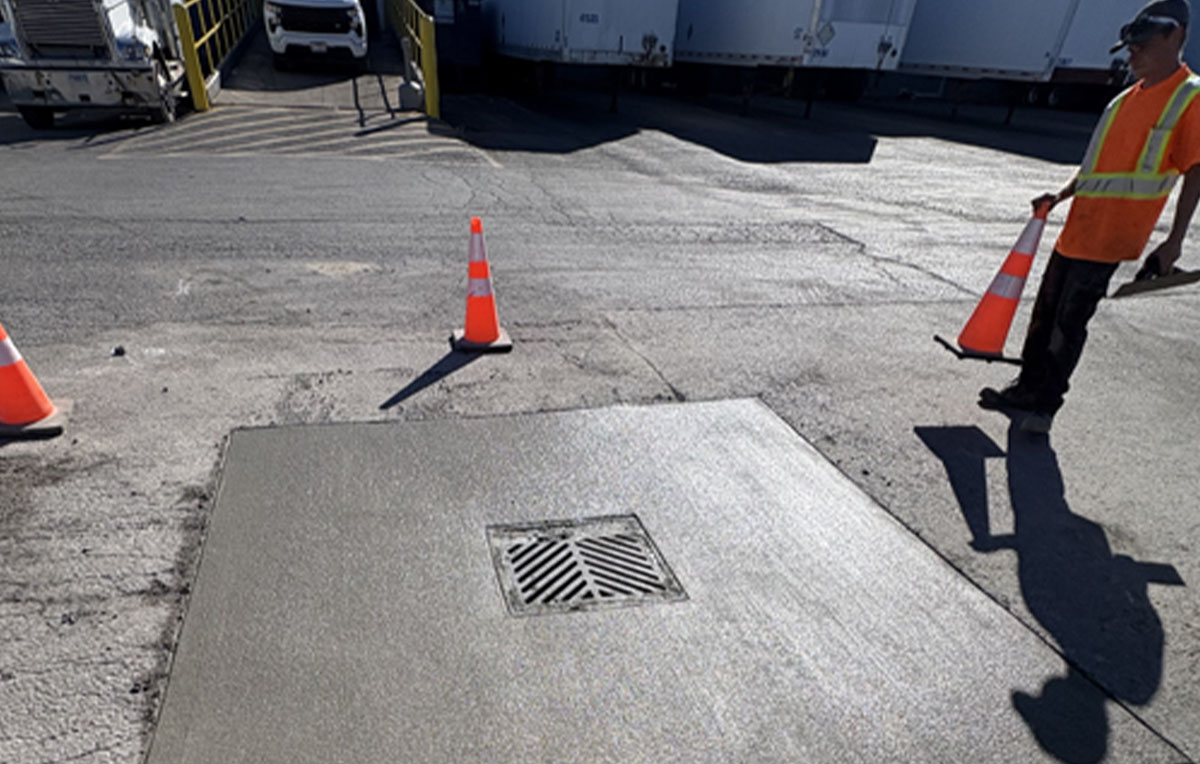 Allsite Services team performing concrete repair and drainage maintenance at a commercial facility site.
